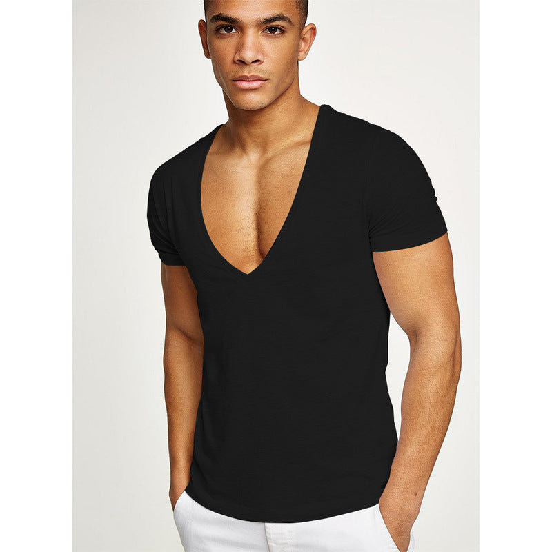 Man wearing a black V-neck tight t-shirt against a white background