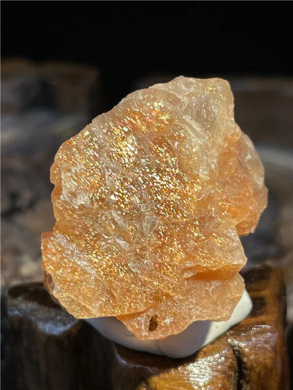 Close-up of a rough amber stone on a dark background