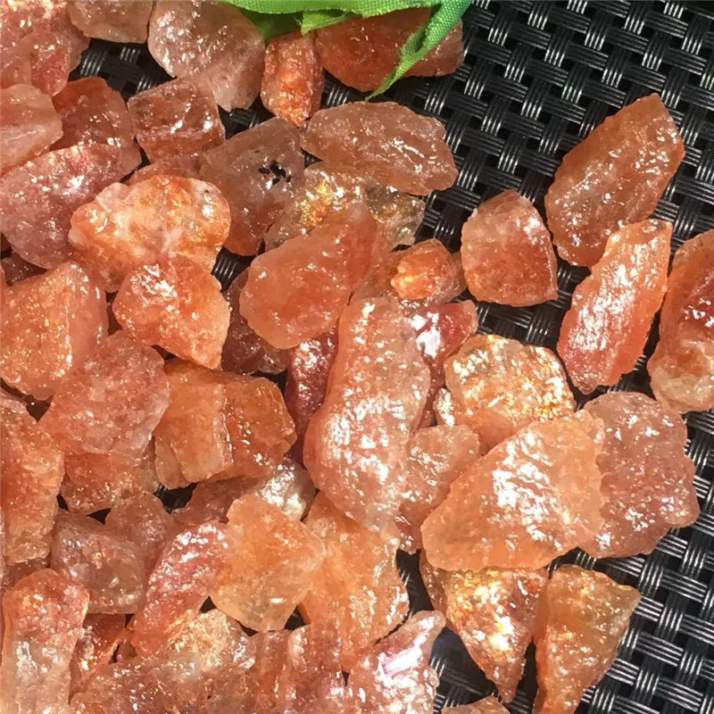 Close-up of orange crystals Natural Rough Sunstone Crystal Stones – 5pcs / 10pcs High Quality Raw Crystals for Tumbling