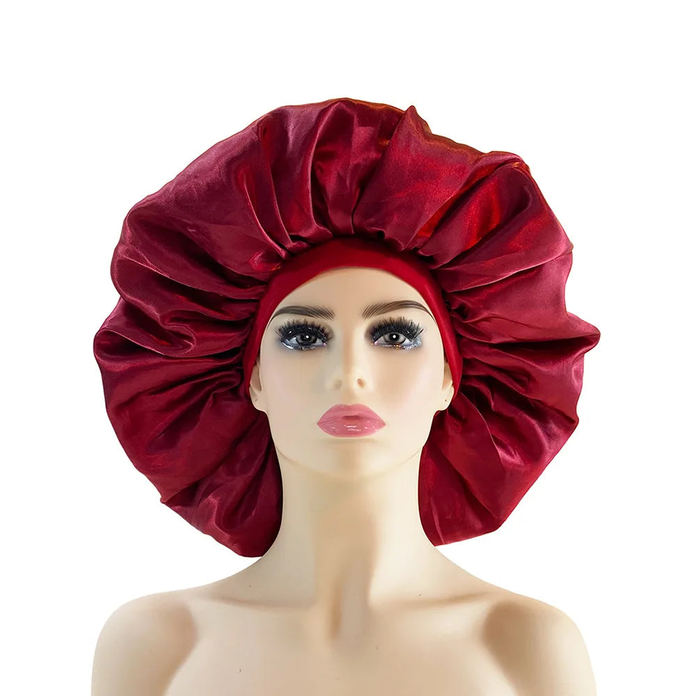 Red satin bonnet on a mannequin head against a white background