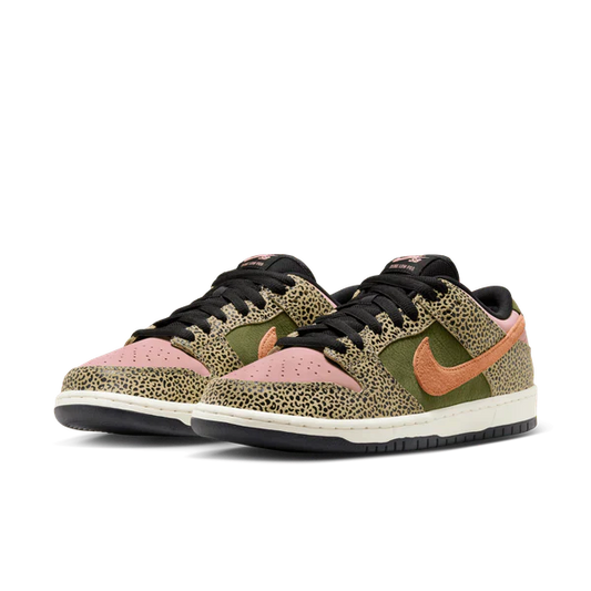 A pair of Nike Dunk Low sneakers featuring a green and black leopard print pattern, light pink perforated toe boxes, and a peach-colored Swoosh on a white background.