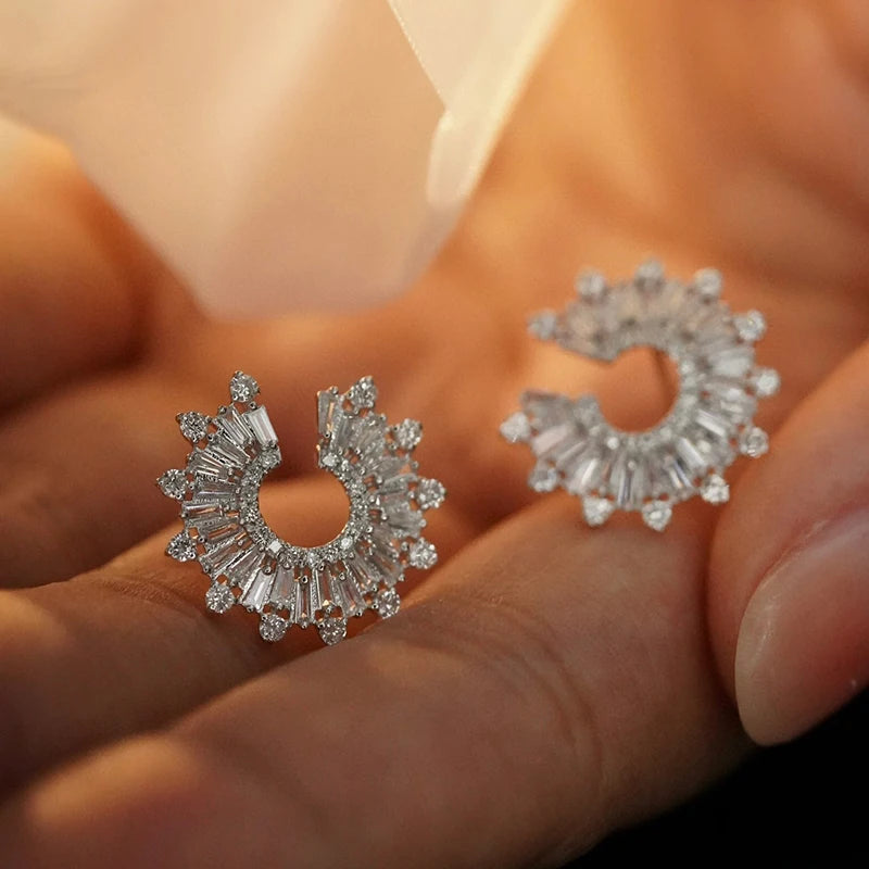 Pair of 18k white gold earrings on a dark green fabric background. 'Aazuo Jewelry' branding. 18K White Gold 1.18ct Diamond Sunflower Stud Earring – Radiant Luxury for Every Celebration

Inspired by the way sunflowers turn toward the light