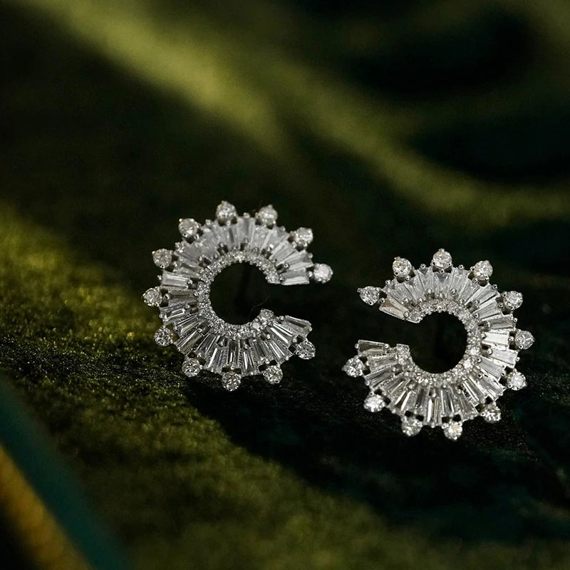 Pair of 18k white gold earrings on a dark green fabric background. 'Aazuo Jewelry' branding. 18K White Gold 1.18ct Diamond Sunflower Stud Earring – Radiant Luxury for Every Celebration

Inspired by the way sunflowers turn toward the light, this exquisite stud earring captures that same radiant energy in a timeless design. Crafted in 18K solid white gold and set with real diamonds, it brings a luminous sparkle to weddings, parties, and every unforgettable moment in between. 