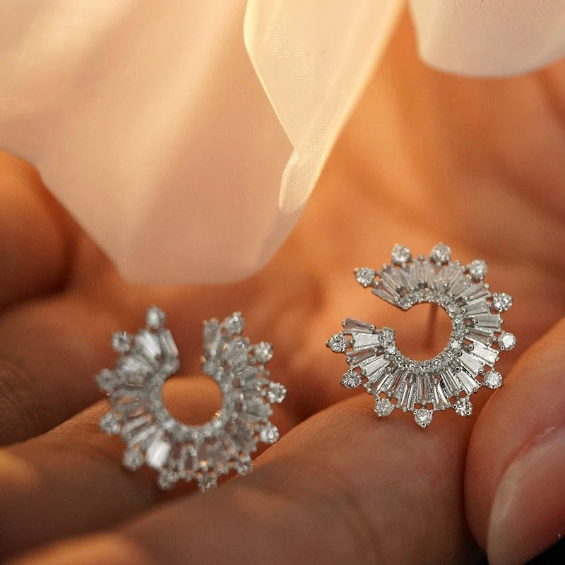 Pair of 18k white gold earrings on a dark green fabric background. 'Aazuo Jewelry' branding. 18K White Gold 1.18ct Diamond Sunflower Stud Earring – Radiant Luxury for Every Celebration

Inspired by the way sunflowers turn toward the light