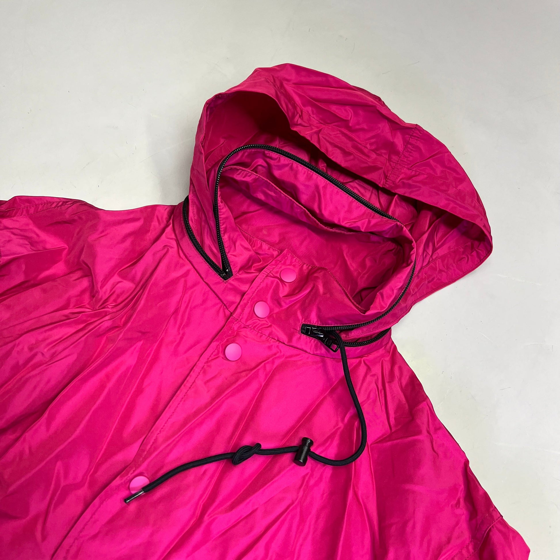 Pink hooded jacket on a white background