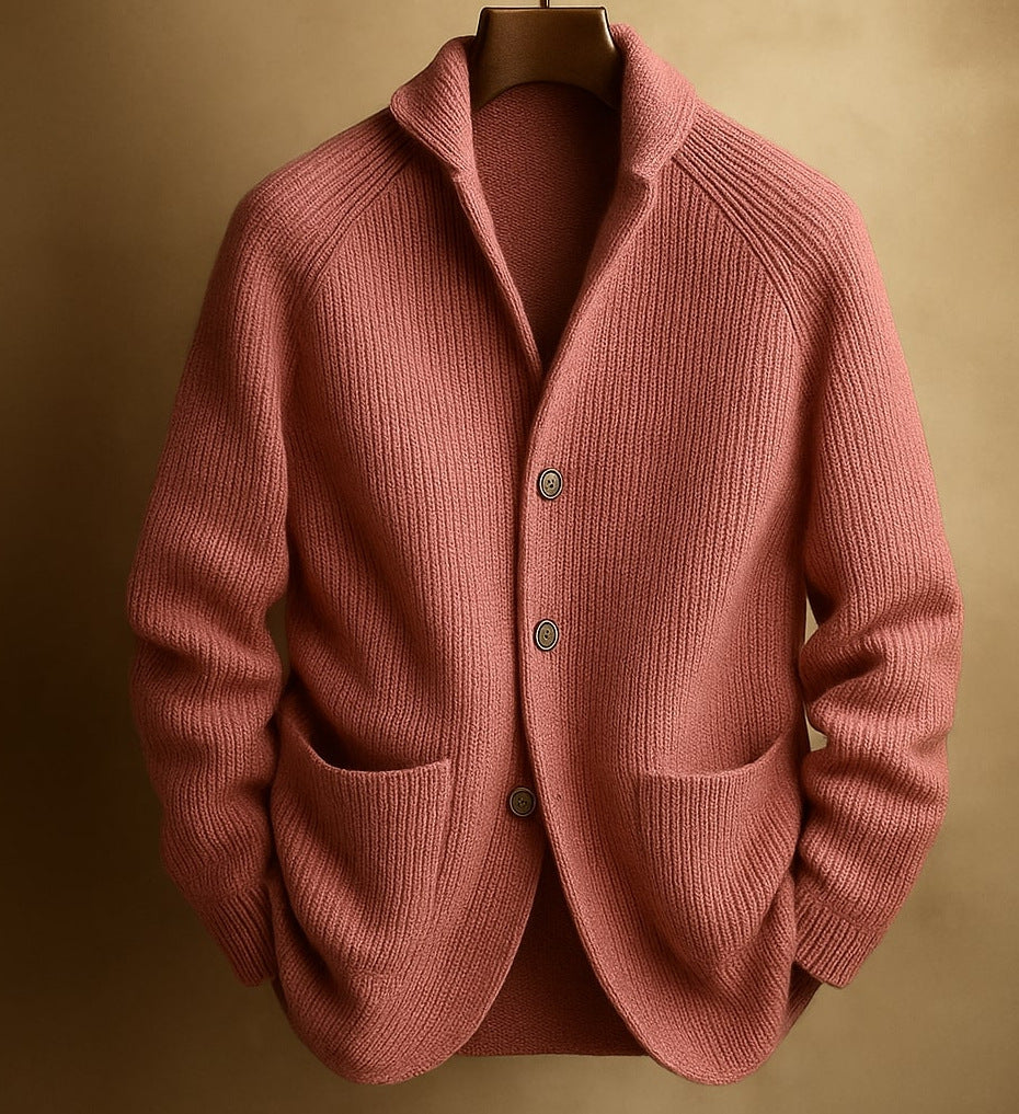 Pink mens knitted cardigan on a mannequin against a beige background