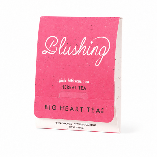 Pink package of Blushing pink hibiscus tea from Big Heart Teas on a white background