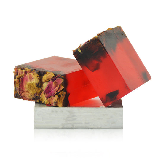 Two resin blocks with floral and red patterns on a white background