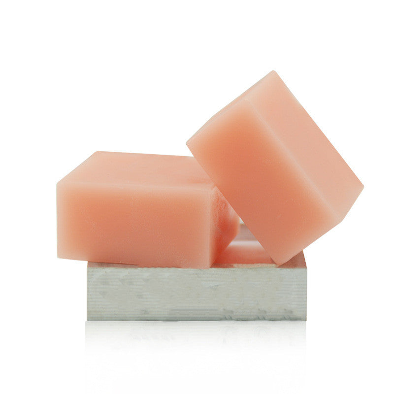 Two pink soap bars on a white background