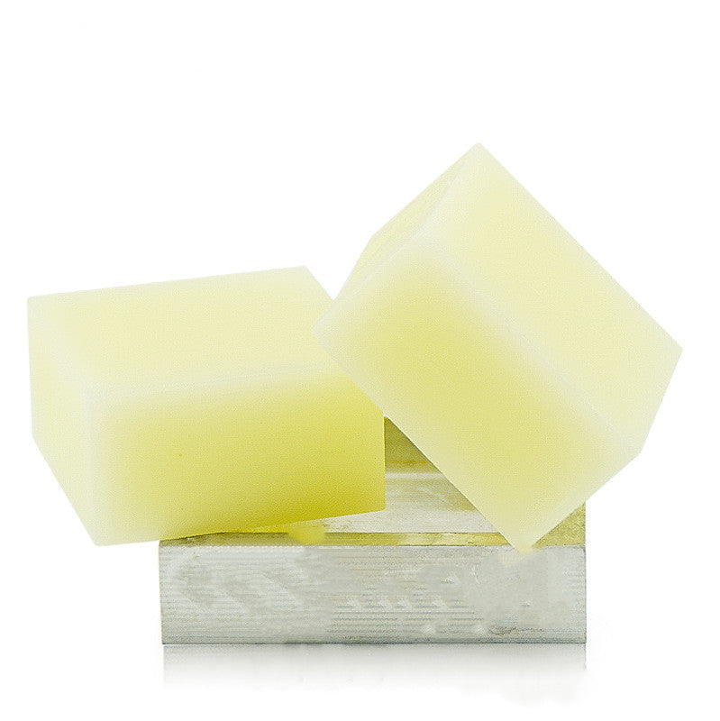 Two yellow soap bars on a white background
