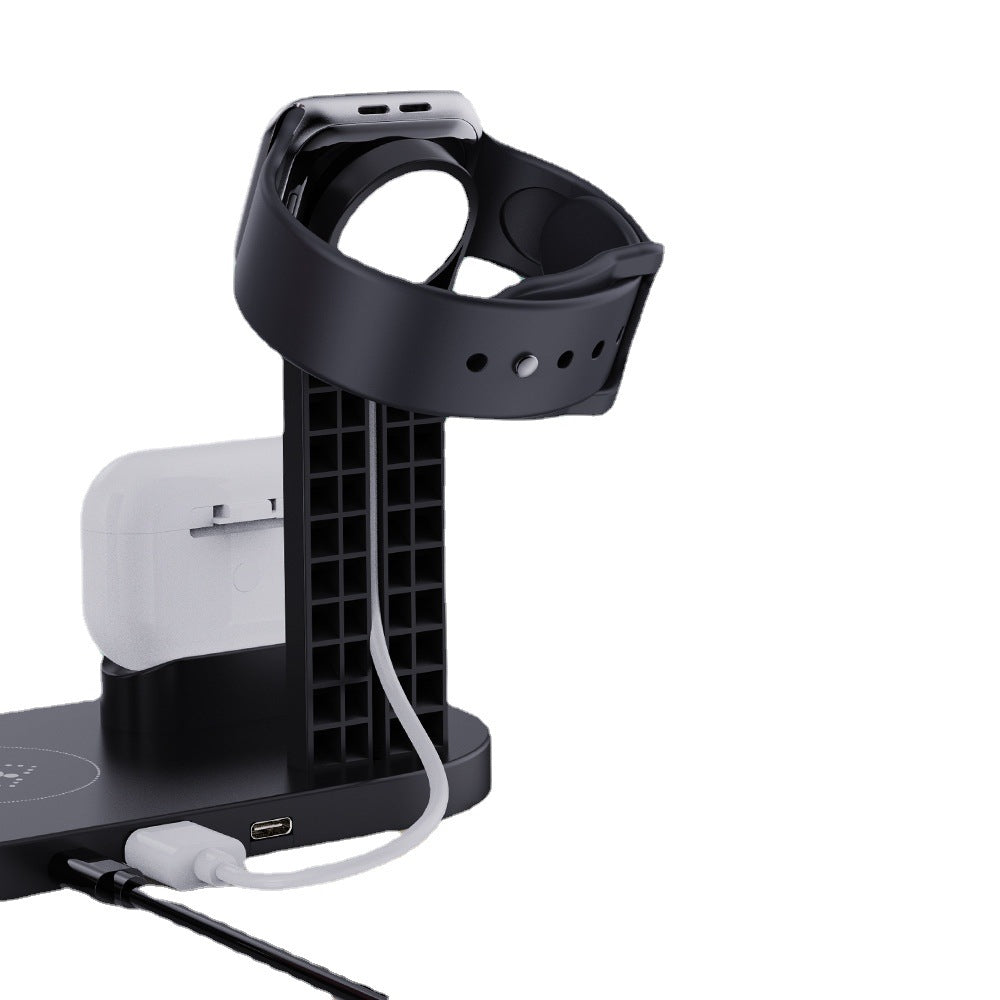 Black smartwatch charging stand with Apple Watch on a white background