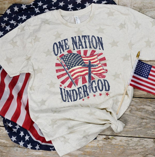 White t-shirt with 'One Nation Under God' design featuring American flags on a wooden surface.