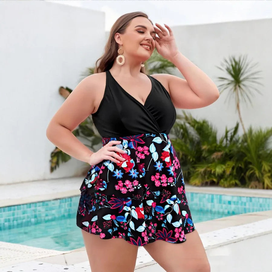 Woman wearing a black top and floral skirt by a poolside Plus Size Women Two Piece Swimsuit Bikini Skirt Top with Shorts for Pool and Sports Occasions Animal Polyester Fabric