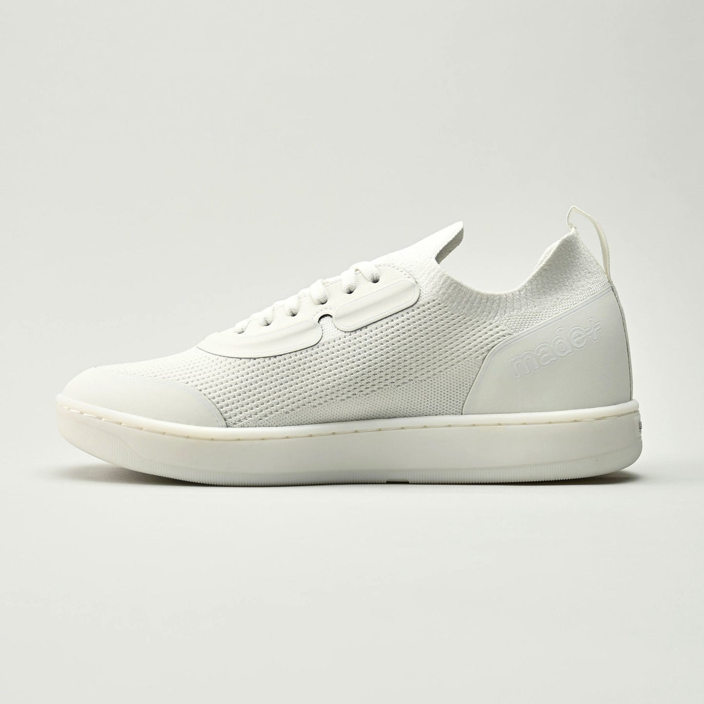 White sneaker on a light gray background