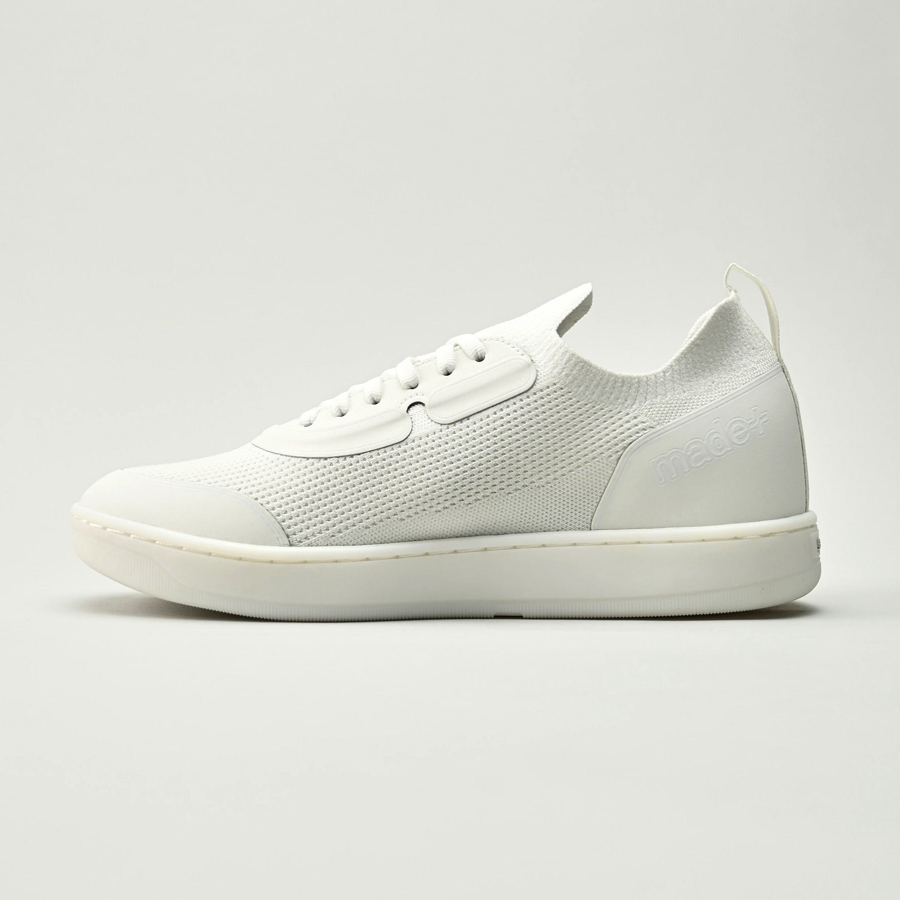 White sneaker on a light gray background
