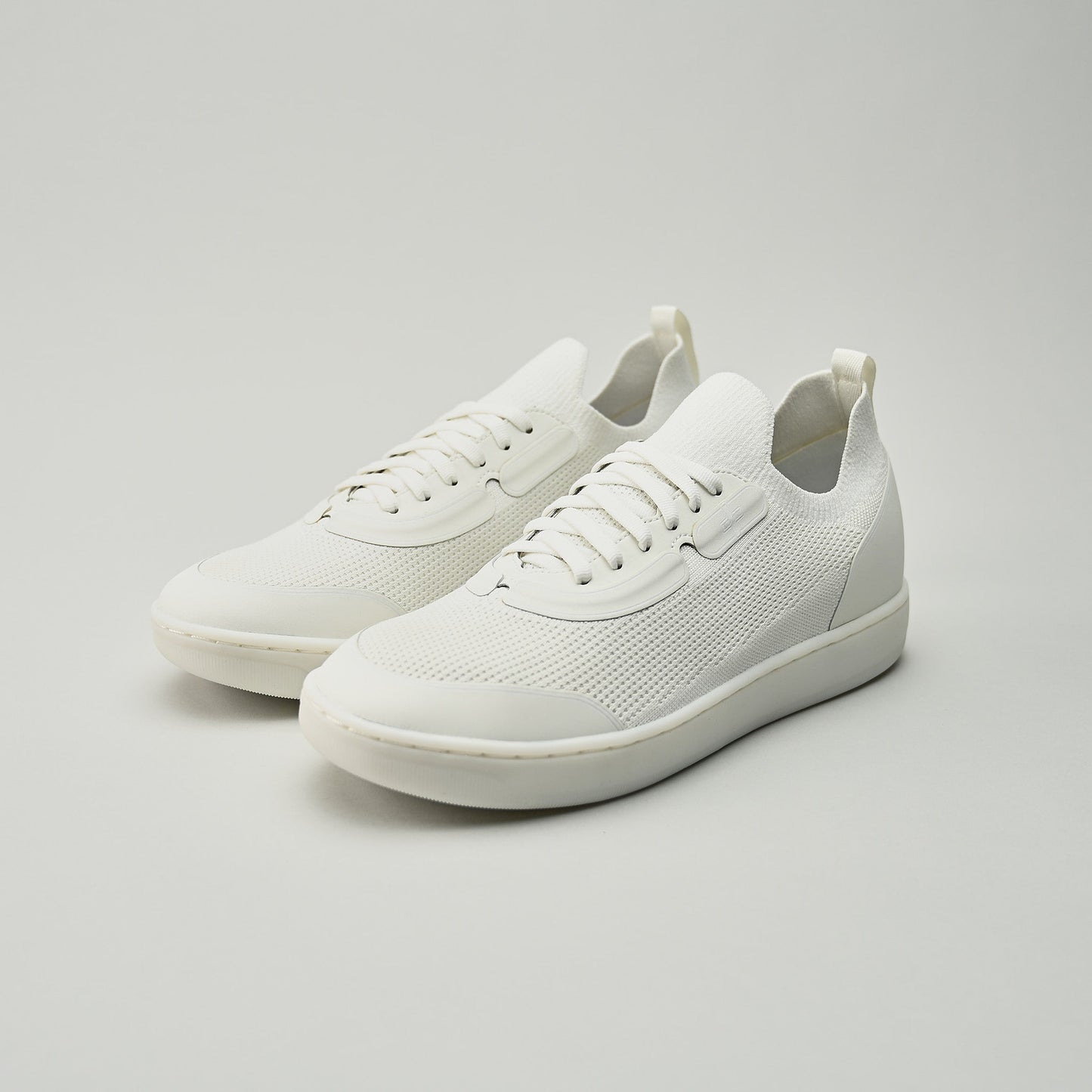 White sneakers on a light gray background