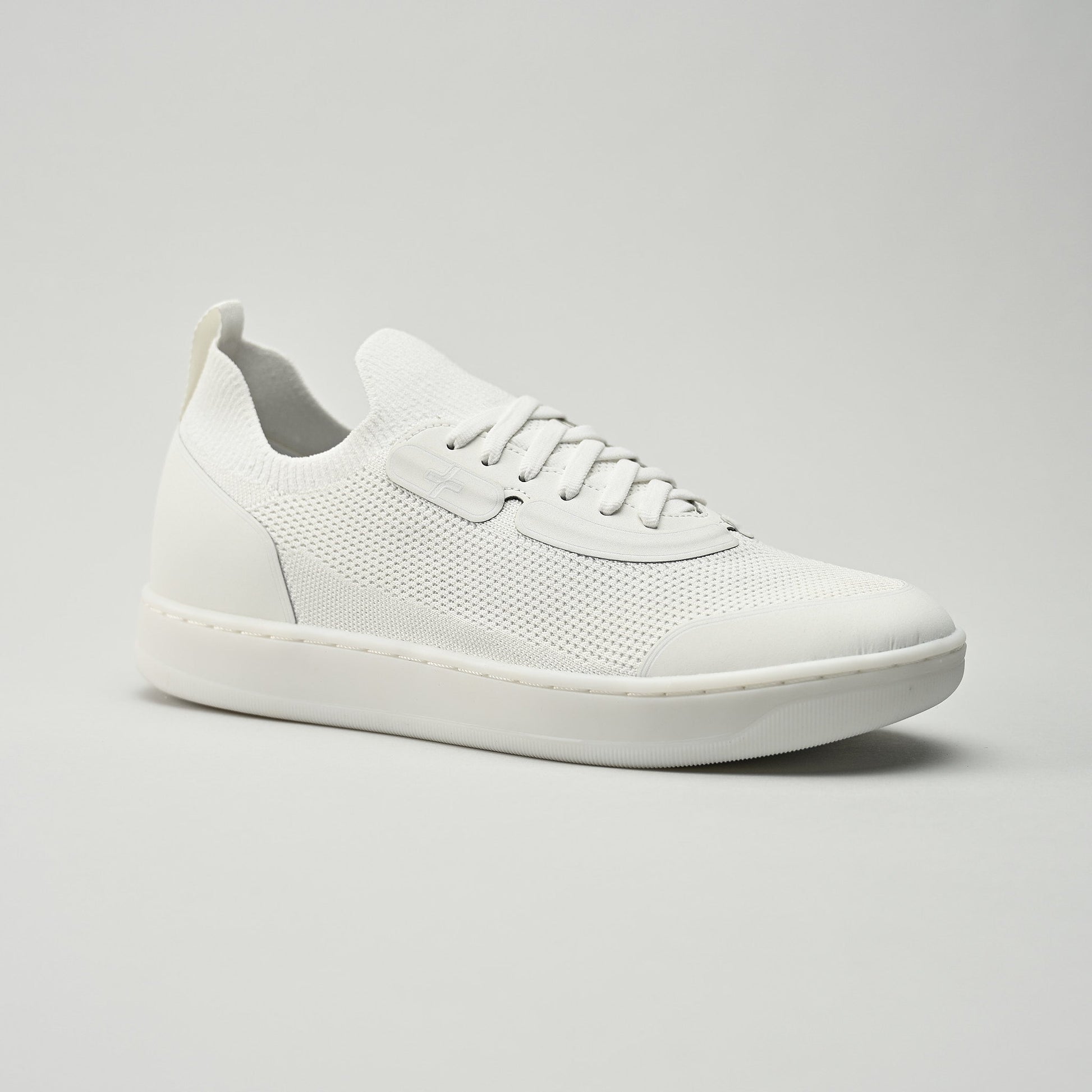 White sneaker on a gray background