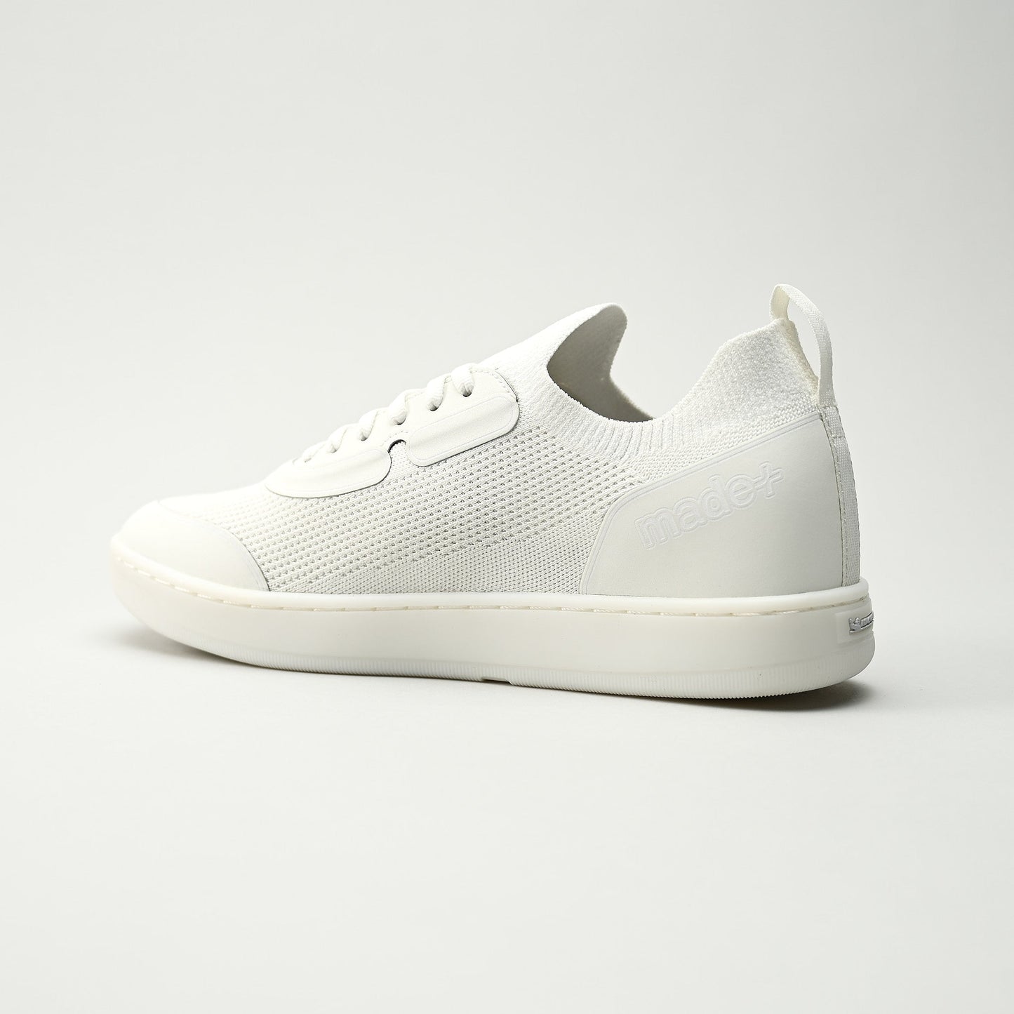White sneaker on a light gray background