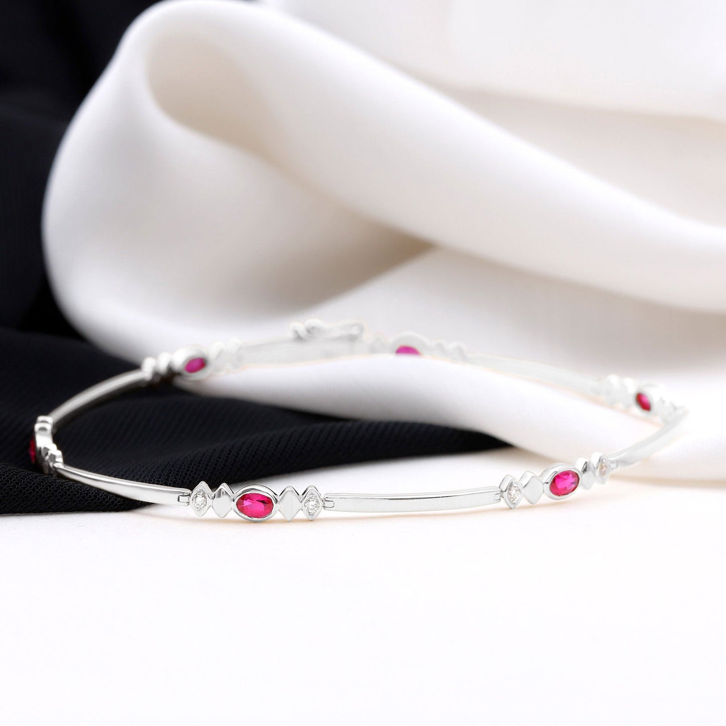 Oval Lab Grown Ruby Link Bracelet with Moissanite