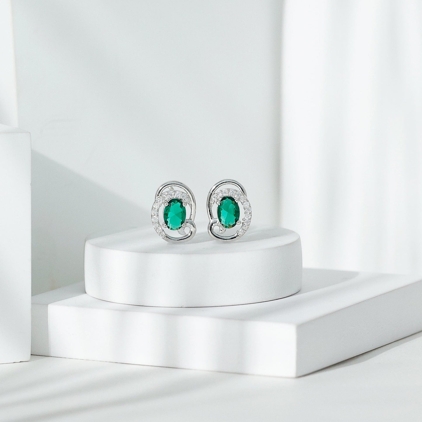 Oval Shaped 1.7 Carat Lab Grown Emerald Designer Earrings in Sterling Silver