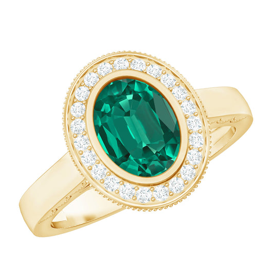 6X8 mm Oval Lab Grown Emerald Bezel Set Engagement Ring With Diamond Halo