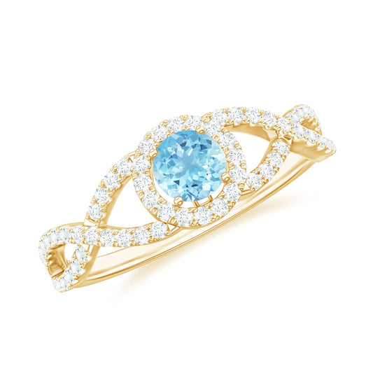 Aquamarine Criss Cross Engagement Ring with Diamond Halo