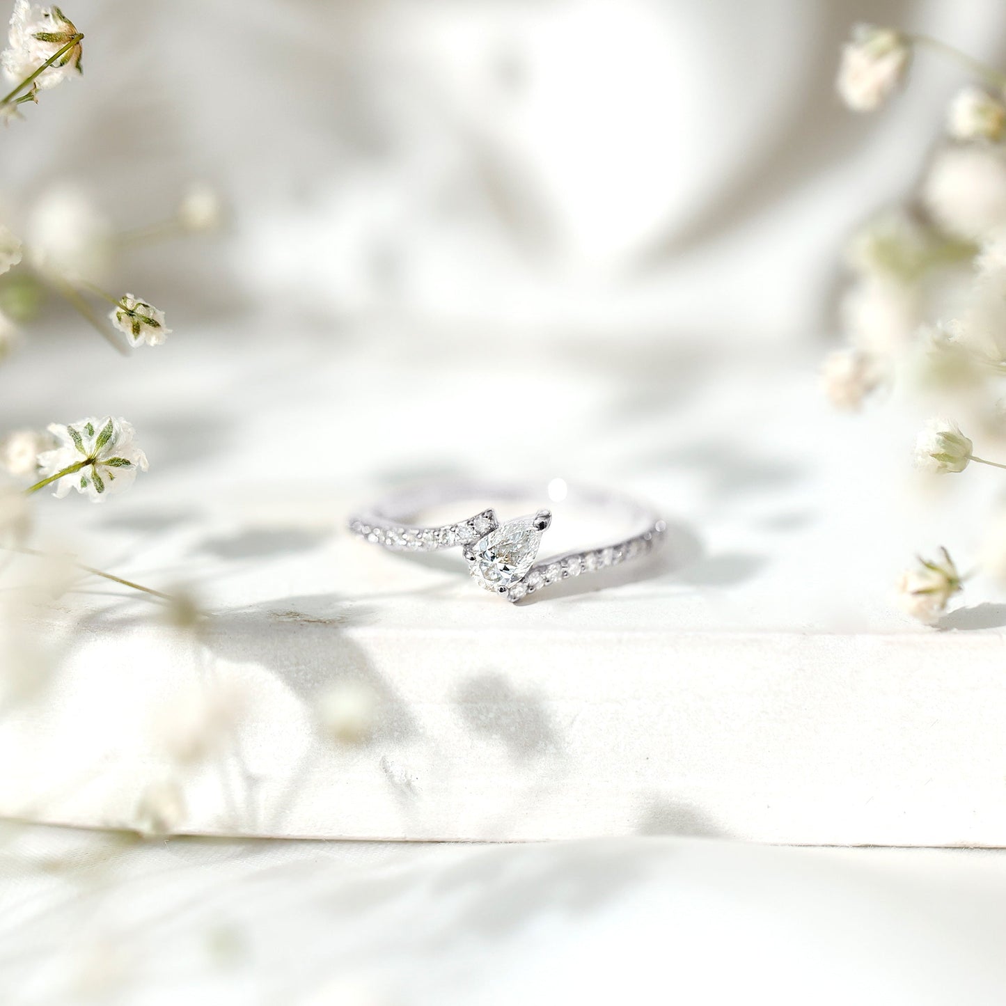 Tilted Pear Shape Simulated Diamond Bypass Promise Ring