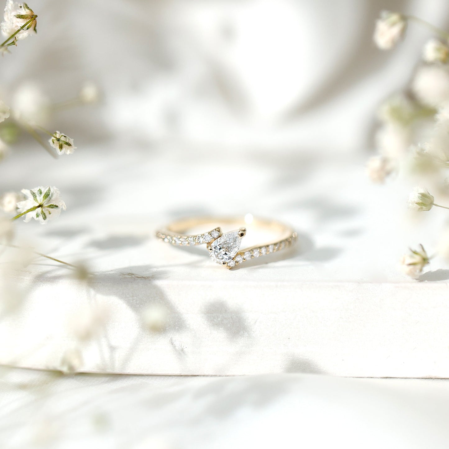Tilted Pear Shape Simulated Diamond Bypass Promise Ring