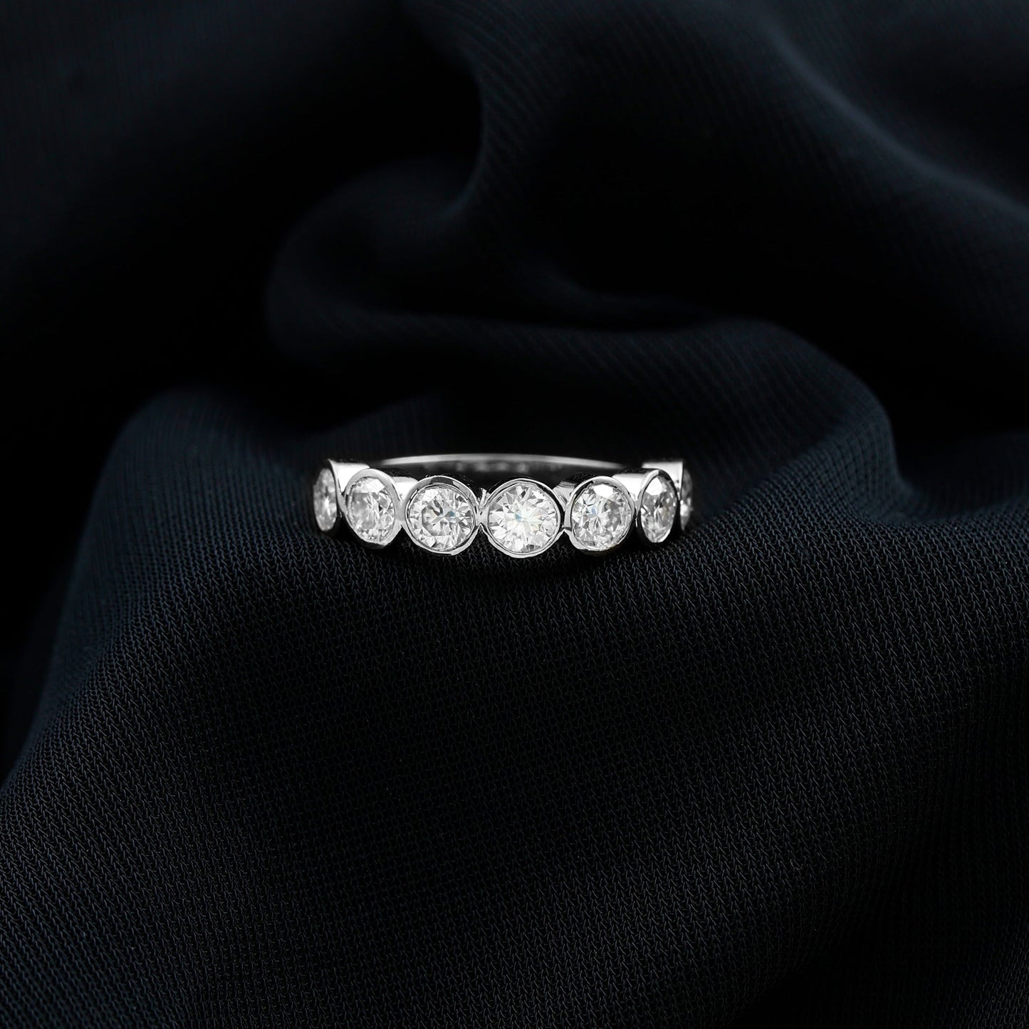 2.2 Carat Round Moissanite Half Eternity Ring in Bezel Setting