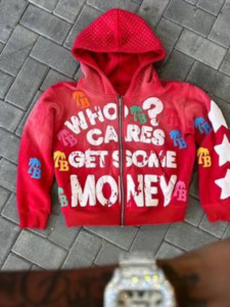 Red hoodie with colorful text on a gray pavement background