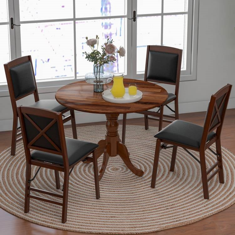 Dining room with wooden table and chairs on a round rug. Round 40-inch Solid Wood Farmhouse Kitchen Dining Table in Medium Brown Finish