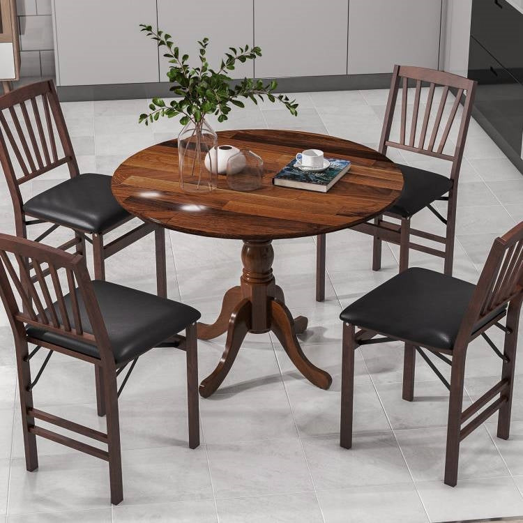 Wooden dining table with four matching chairs on a tiled floor. Round 40-inch Solid Wood Farmhouse Kitchen Dining Table in Medium Brown Finish