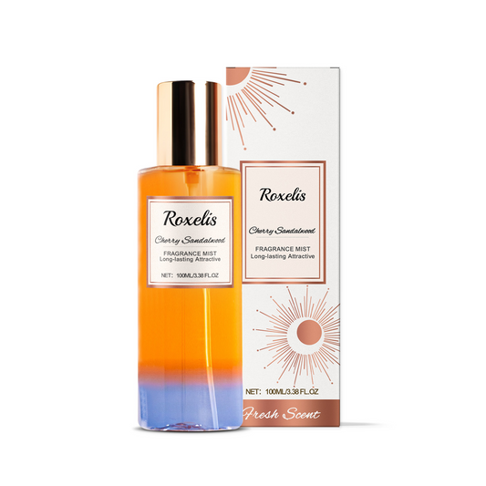 Roxelis Cherry Sandalwood Fragrance Mist bottle with matching retail box on a white background. Long-lasting body fragrance spray with warm cherry and sandalwood scent, elegant everyday perfume for women, 100 mL.