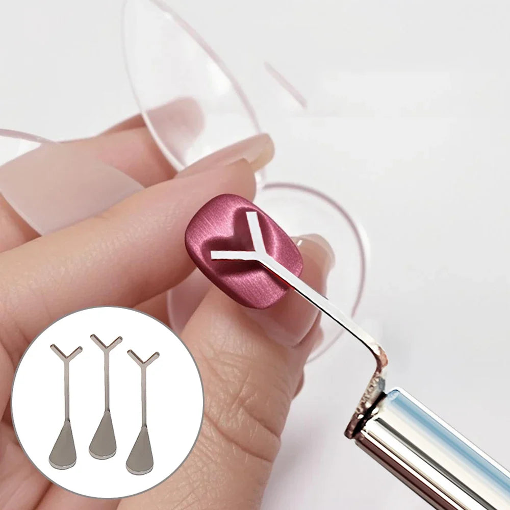 A hand holding a pink and silver heart-shaped magnetic nail art tool, with an inset image showcasing a collection of three similar magnetic sticks used for creating cat-eye gel polish patterns.