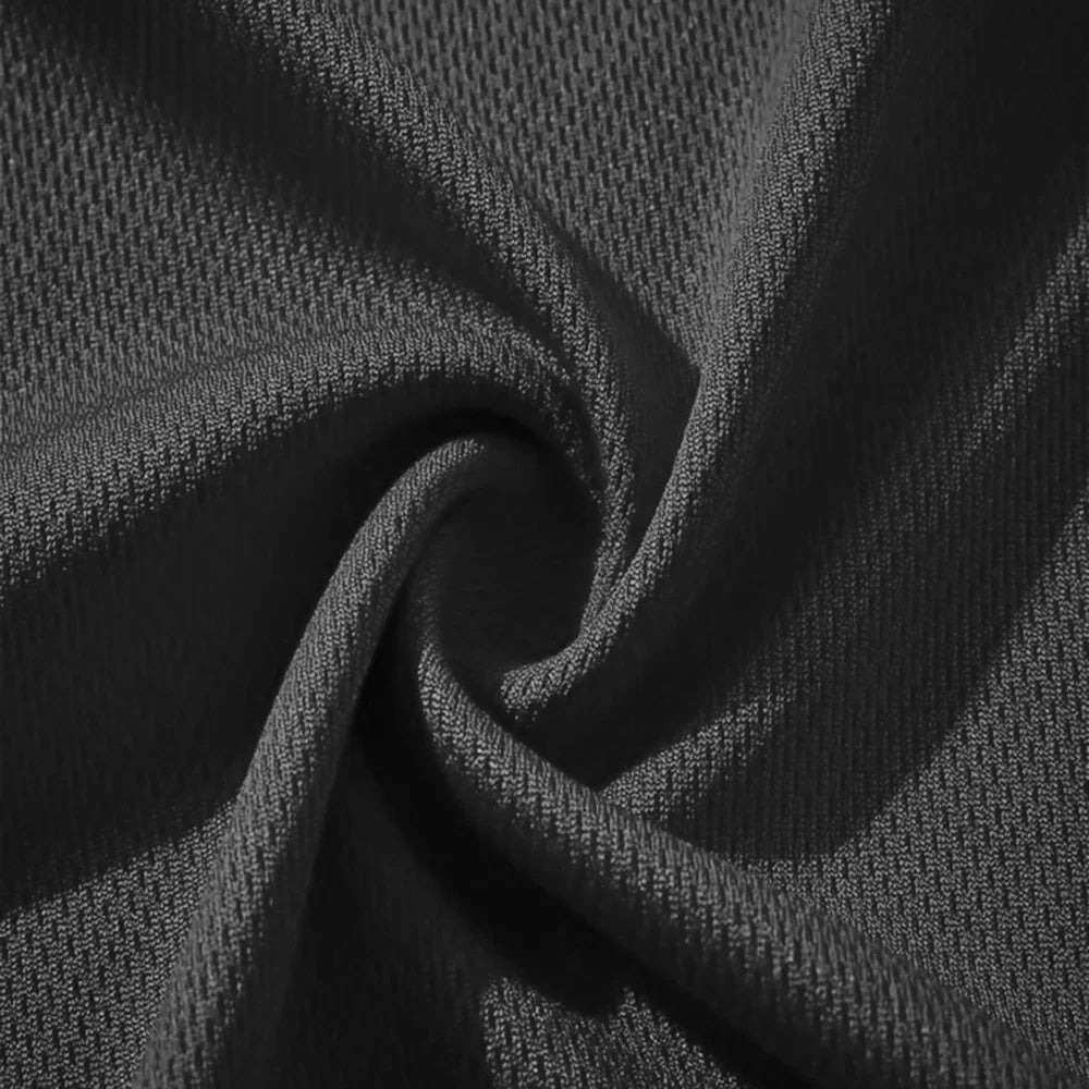 Close-up of dark gray fabric with a textured pattern