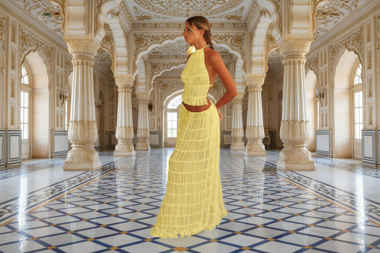 Woman wearing a yellow halter neck dress on a white background
