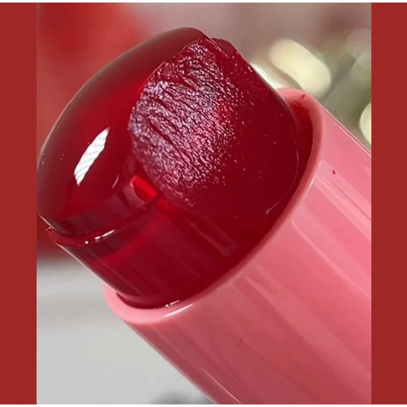 Close-up of a red lipstick with a blurred background