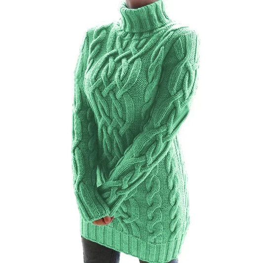 Green cable knit sweater on a white background