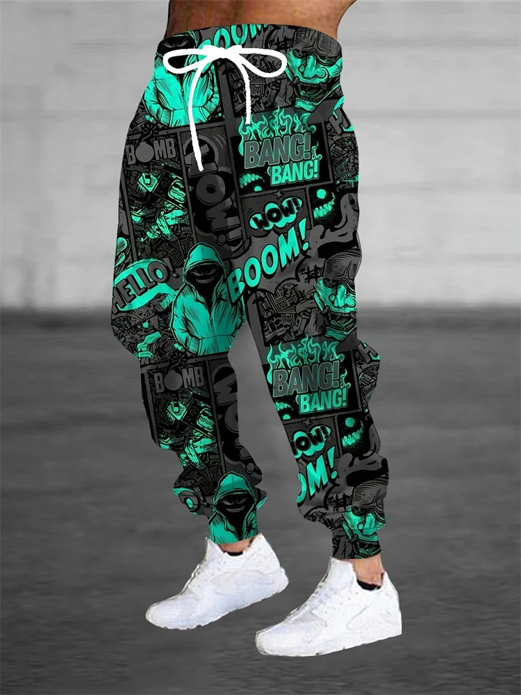 Black and green patterned pants with text worn by a person on a gray background