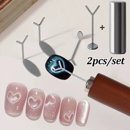 A 2-piece love-shaped nail art magnet set featuring Y-shape iron wire magnetic sticks for cat-eye gel polish designs, displayed on a clean white background.