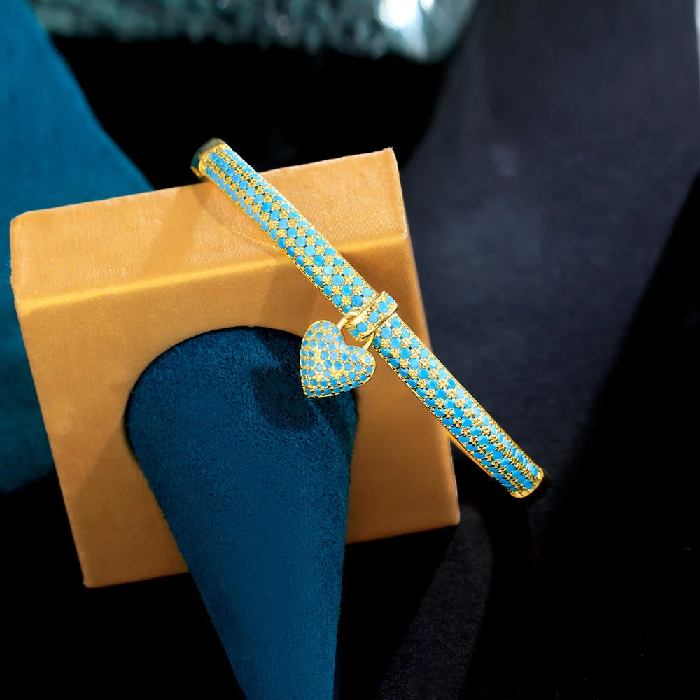 ThreeGraces Elegant Light Blue Cubic Zirconia Gold Color Small Heart Charm Luxury Open Cuff Bangle for Women Party Jewelry B080