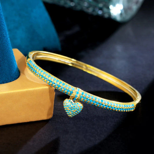 ThreeGraces Elegant Light Blue Cubic Zirconia Gold Color Small Heart Charm Luxury Open Cuff Bangle for Women Party Jewelry B080