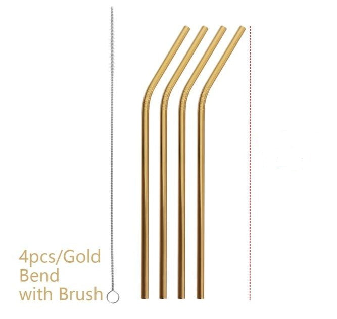 Set of four gold bendable straws with a brush on a white background
