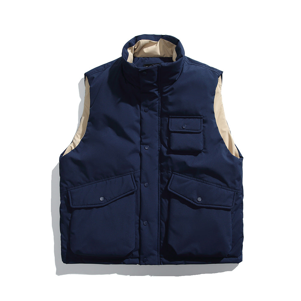 aNavy blue men's insulated workwear puffer vest with stand collar, snap and zip front, multiple utility pockets, and sleeveless lightweight design for casual outdoor wear.
