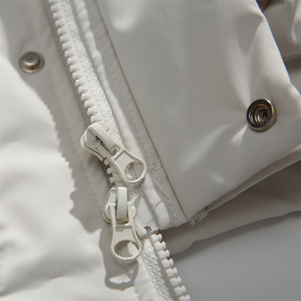 Men's sleeveless zip-up vest in beige or navy blue featuring a stand collar, loose fit, and lightweight polyester construction for casual streetwear layering. Closeup Shot of the zipper and buttons.