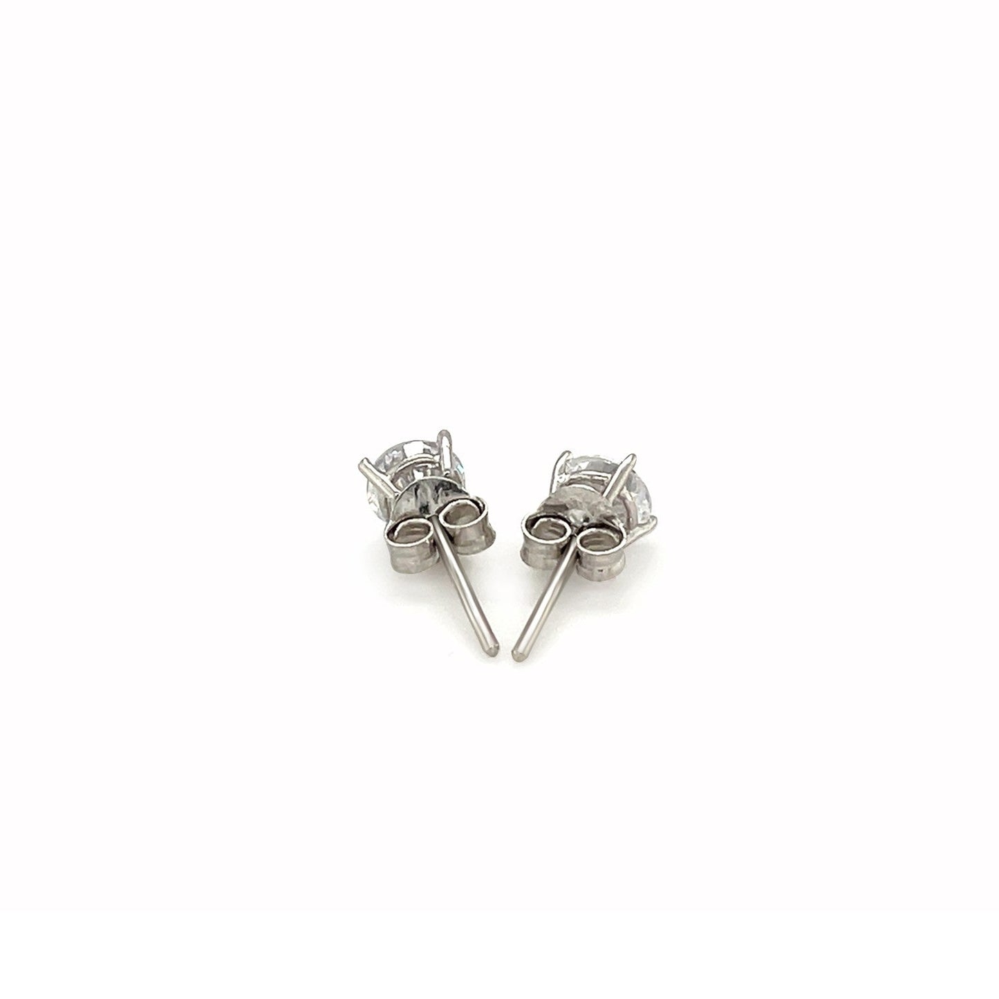 Pair of silver stud earrings on a white background