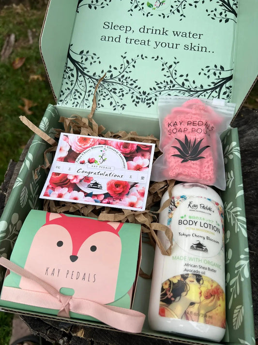 Gift set with body lotion, soap, and other items in a decorative box. Tokyo Cherry Blossom Bundle Gift Set