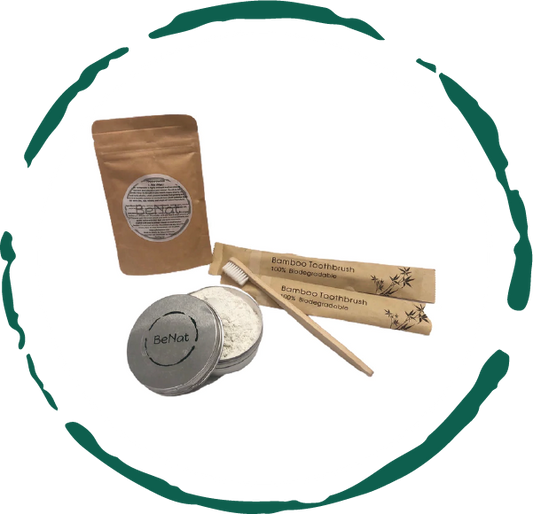 Set of bamboo toothbrushes, dental floss, and a container with a brand logo on a white background.