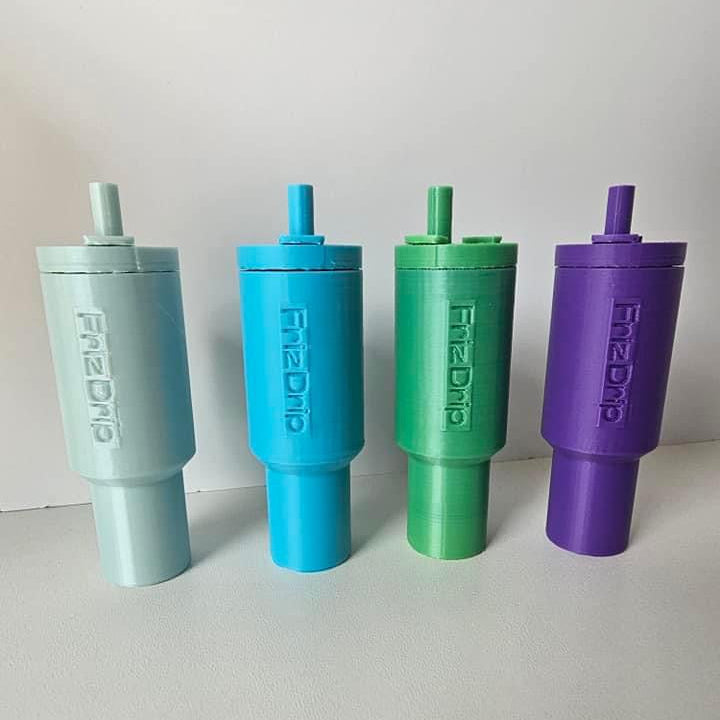 Four pastel-colored tumbler style lip balm holder keychains in mint green, blue, green, and purple standing upright on a white surface against a white background.