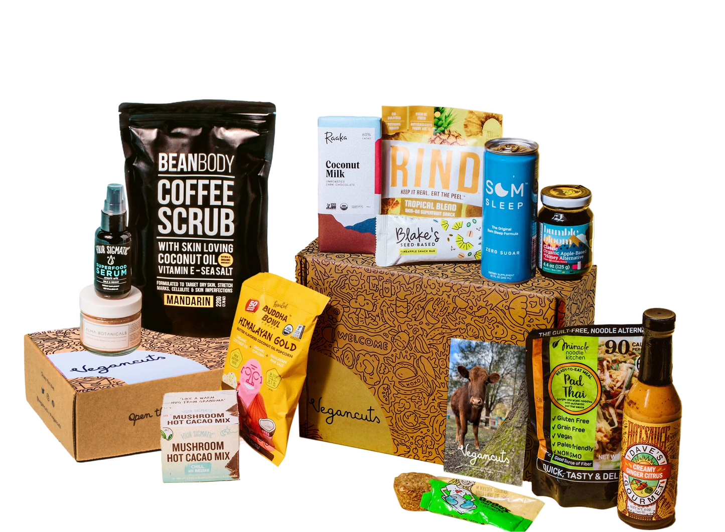 Collection of various products including a coffee scrub, hot cocoa mix, and other items on a light green background.